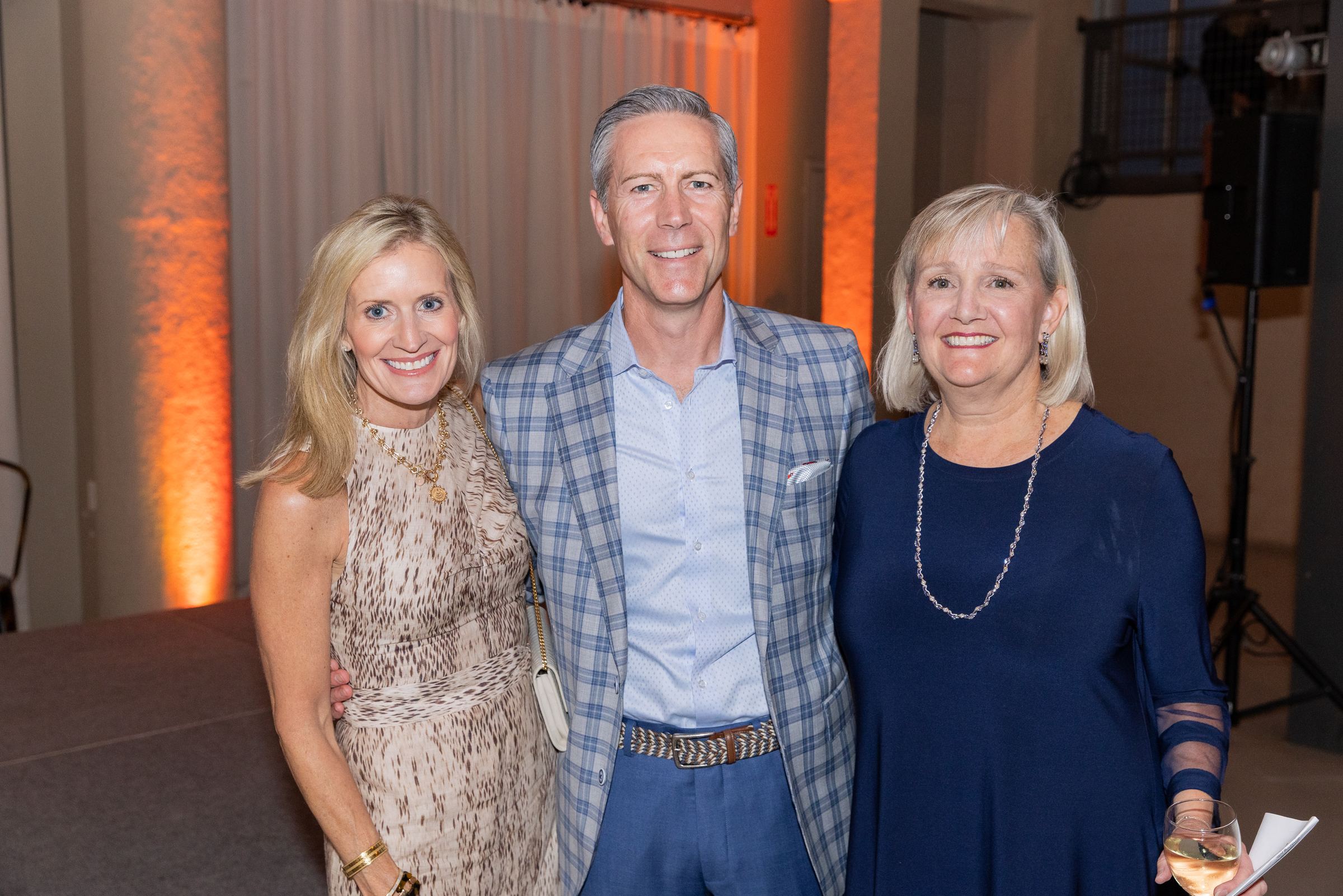 Megan and Stu Bradley with Woman's Board president Kate Peterson